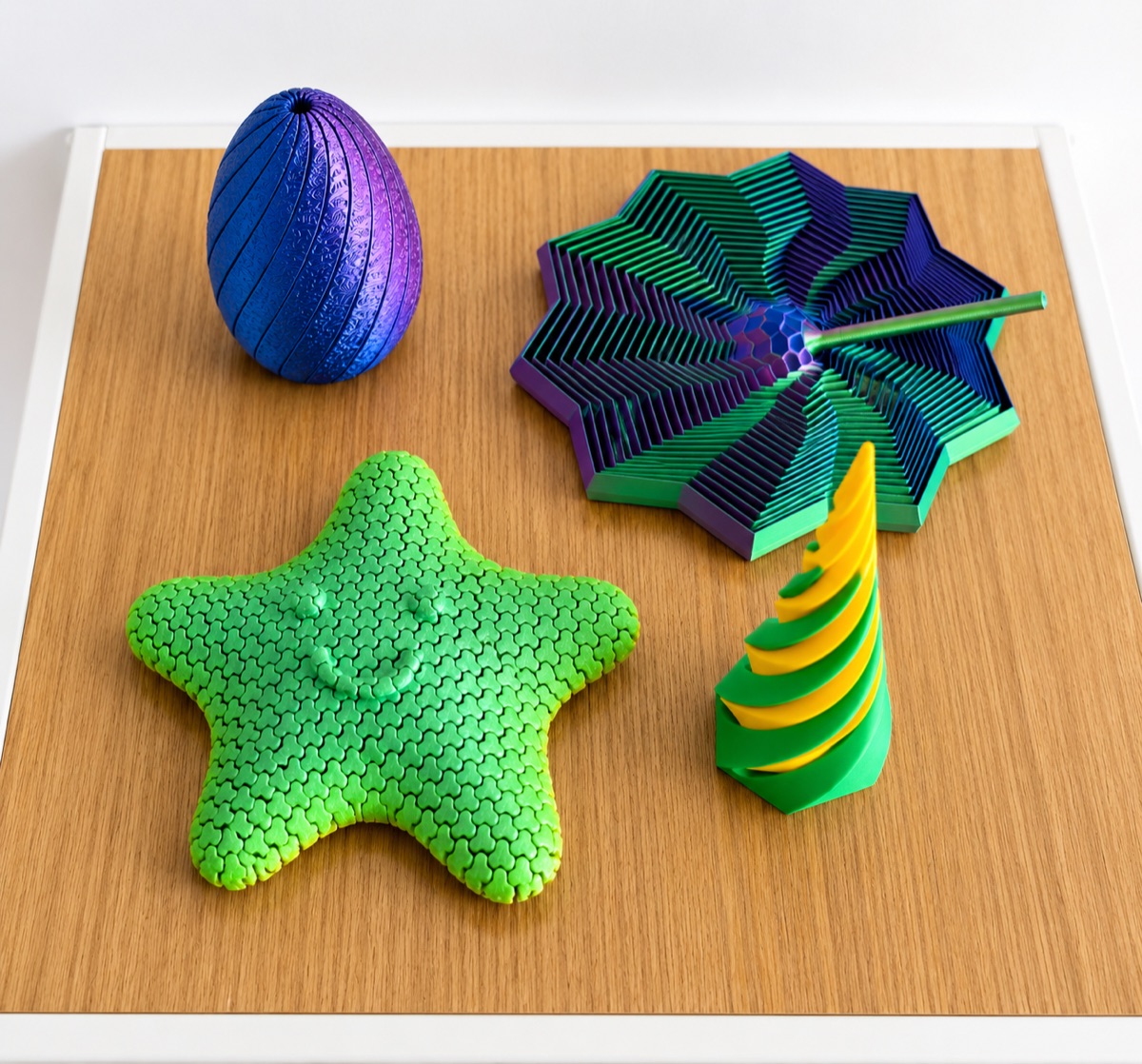 A set of colourful 3D-printed fidget toys on a wooden table
